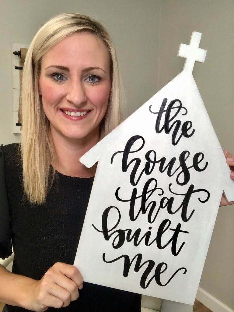 Danielle Stringer with hand lettered church door hanger