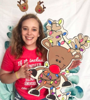 Kayla Deckard holding painted Tangled Rudolph