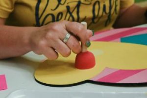 Using a sponge pouncer to paint the perfect polka dot