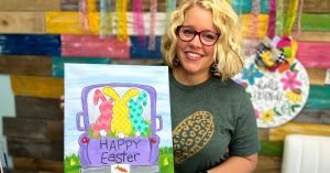 Tamara holding the canvas with the Easter Truck design