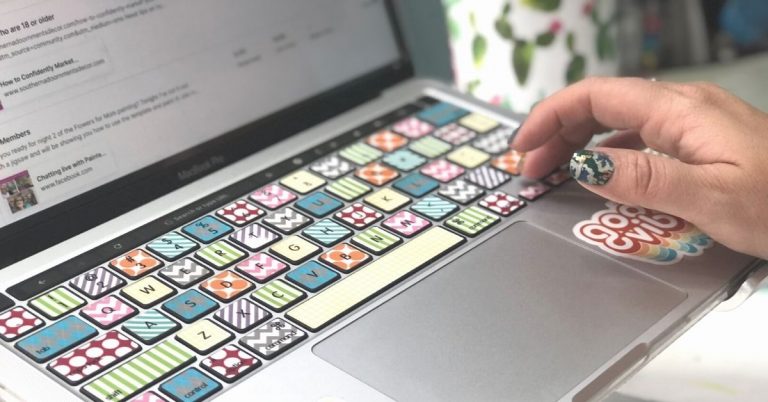 Computer with Colorful keyboard and hand pressing keys