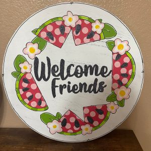 "welcome friends" door hanger with watermelon slices along the edge
