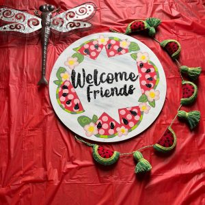door hanger with watermelons along edge that reads "welcome friends"