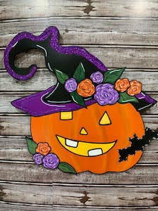 jack-o-lantern pumpkin with a witch hat