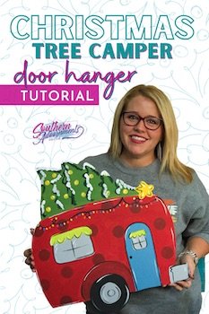 Tamara holding the Christmas camper door hanger